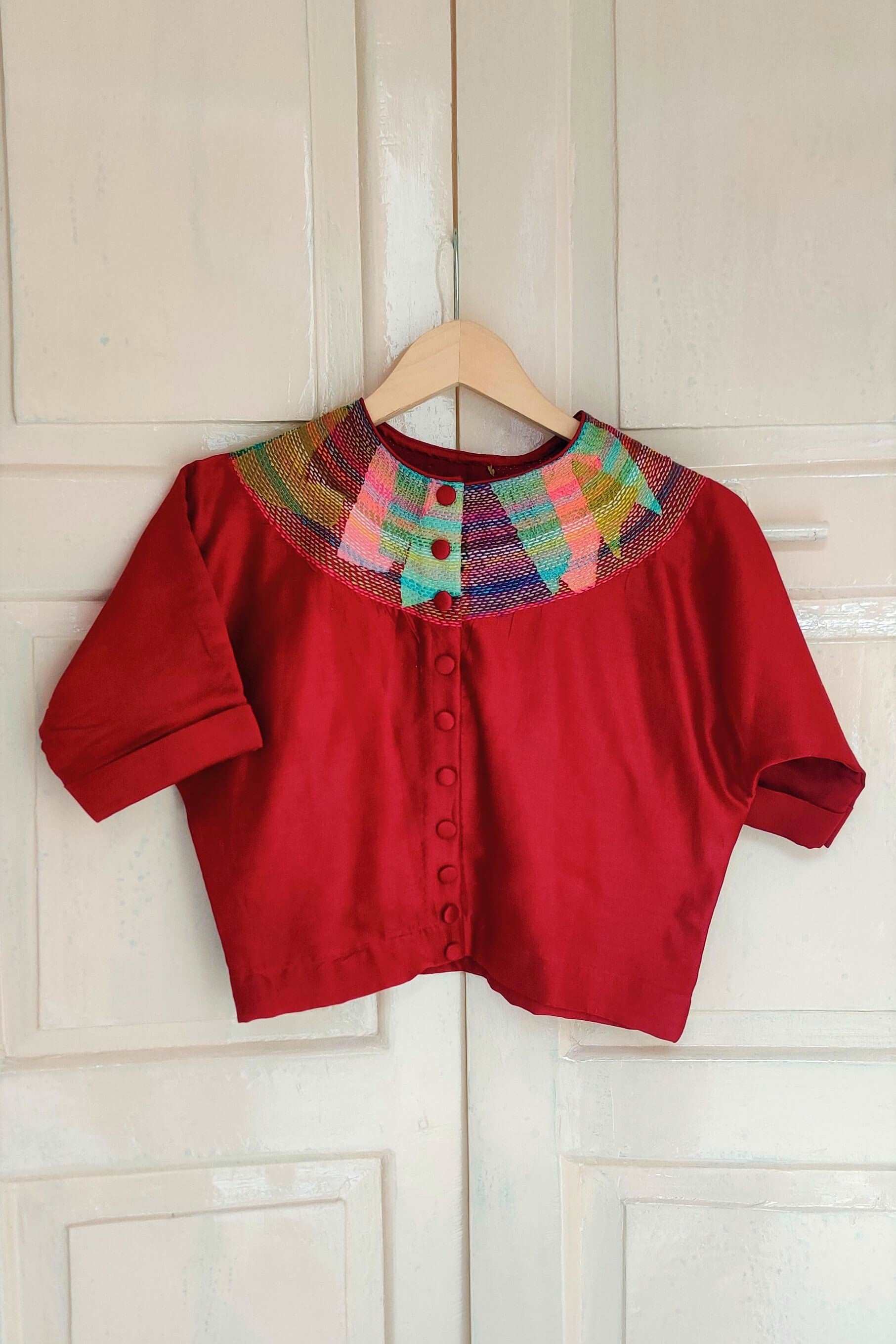 Cotton-silk Red crop top with sujani work on neck line.