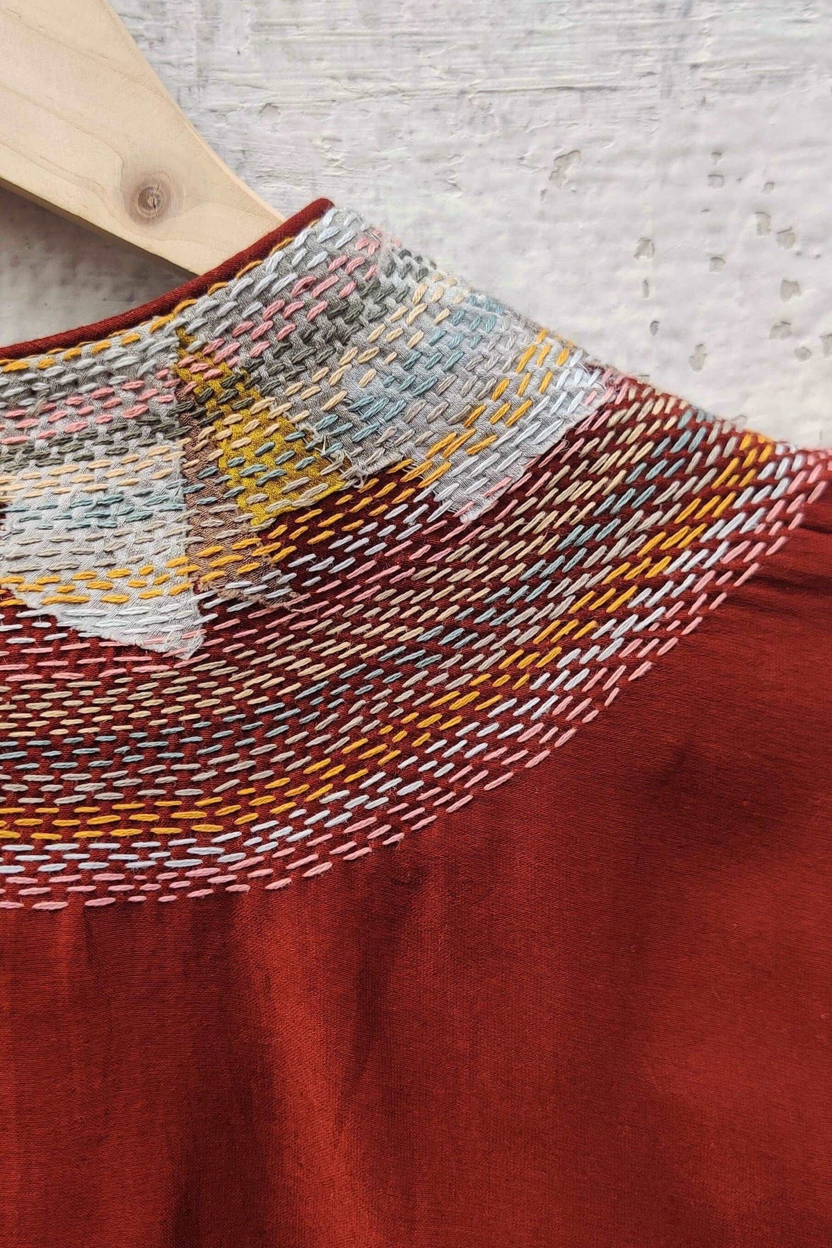 Cotton-silk Rust crop top with sujani work on neck line.